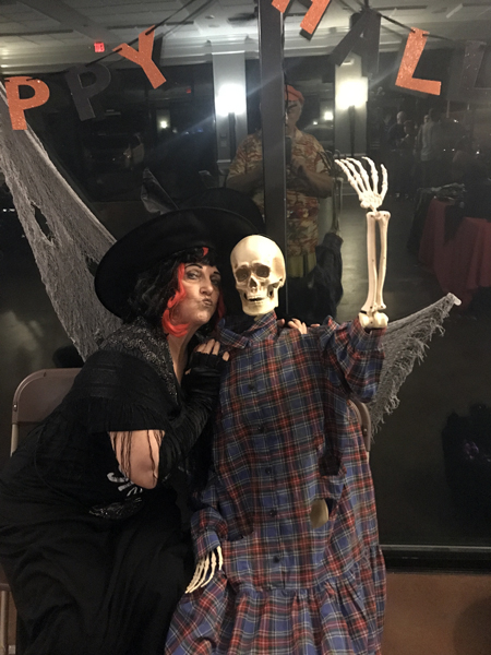 Karen Duquette kissesd the skeleton